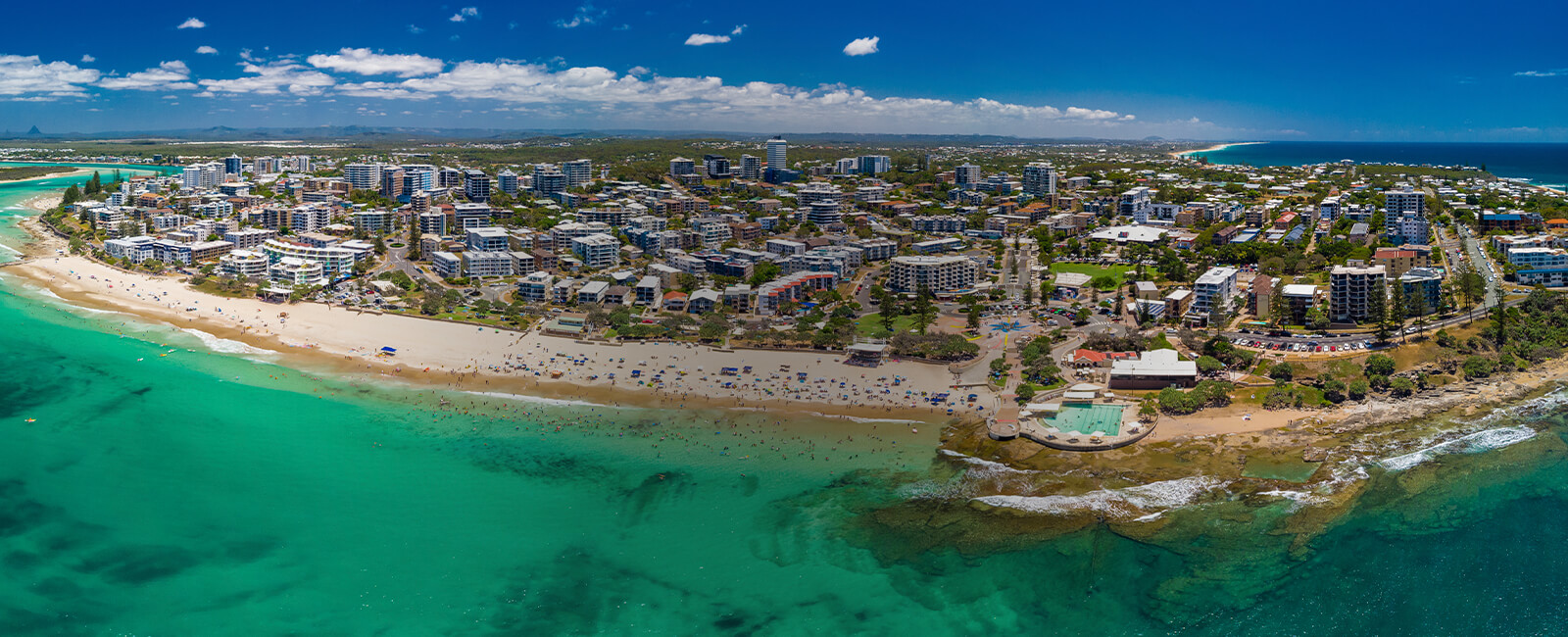 Aerial view of Caloundra Beach with city in background
